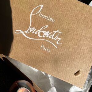 Size 40 multi color Louboutin heels never worn NWT